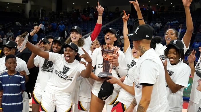 The Las Vegas Aces celebrate after winning the 2022 Commissioner’s Cup.